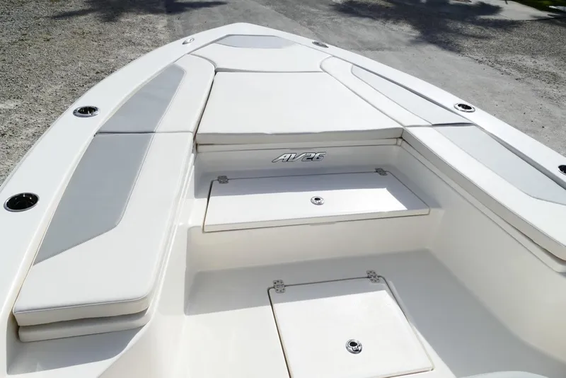 Slide: The Image of 2026 Avenger AV26 boat interior with cushioned seating and storage compartments. - 37