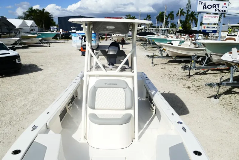 Slide: The Image of 2026 Avenger AV26 boat displayed at a dealership with other boats in the background. - 47