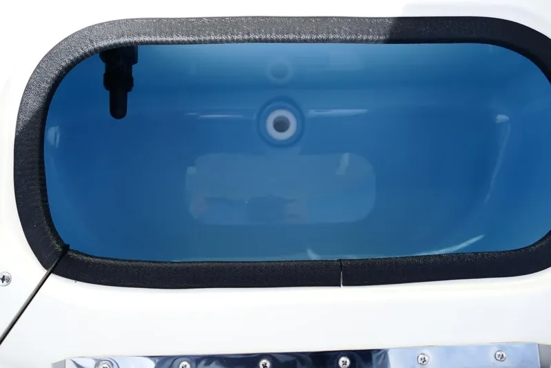 Slide: The Image of 2026 Avenger AV26 boat livewell with blue interior and black trim. - 50