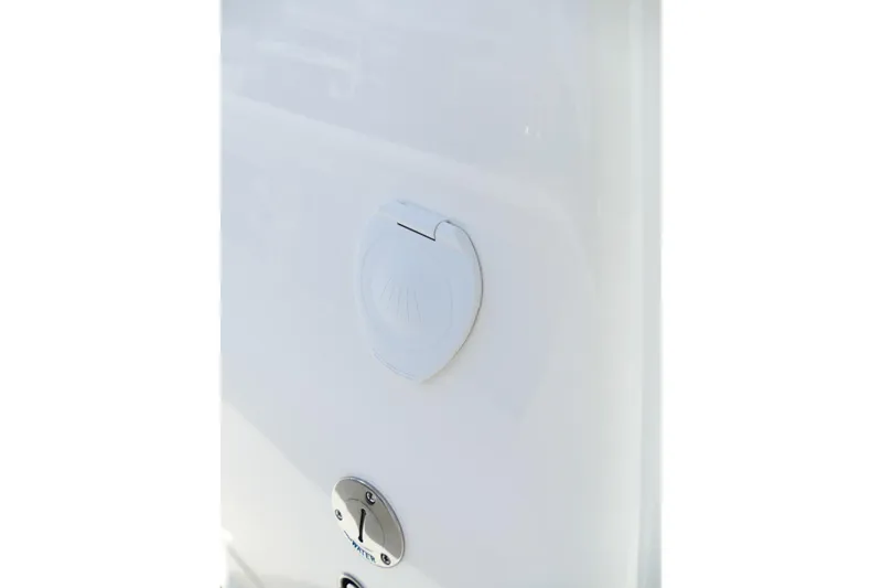 Slide: The Image of 2026 Avenger AV26 water inlet and lock on white surface. - 52