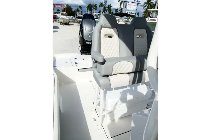 Slide: The Image of 2026 Avenger AV26 boat interior with dual seats and Suzuki 350 outboard motor. - 53