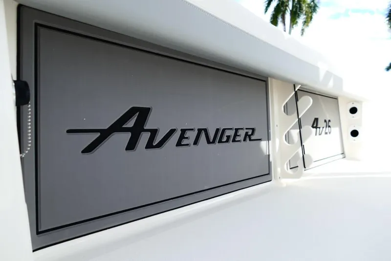 Slide: The Image of Avenger AV26 2026 boat logo on sleek gray panel, modern design. - 54