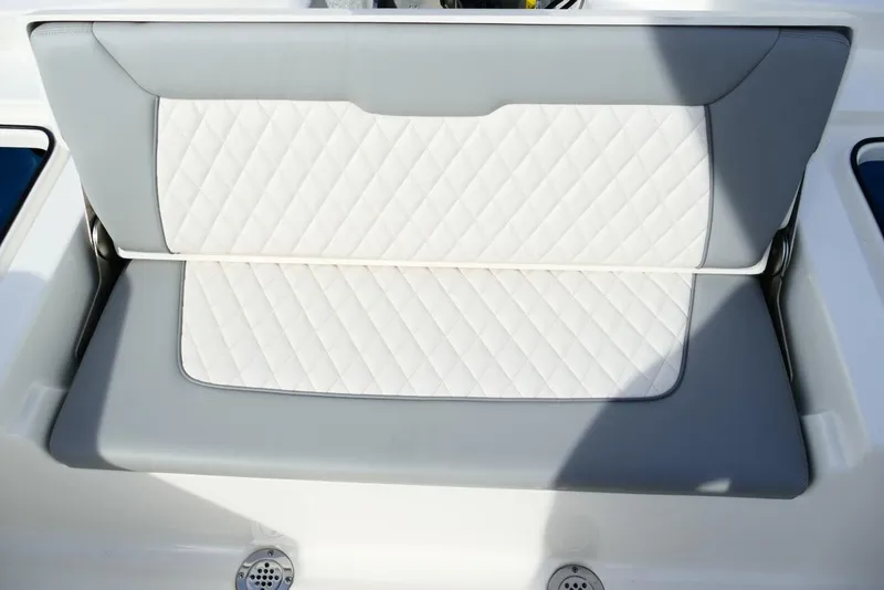 Slide: The Image of 2026 Avenger AV26 boat seat with quilted white and gray upholstery. - 58