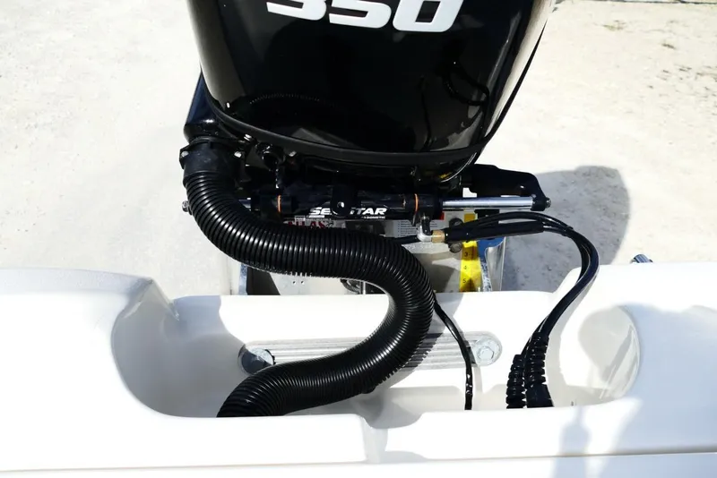 Slide: The Image of Outboard motor on Avenger AV26 boat, 2026 model, featuring SeaStar hydraulic steering. - 63