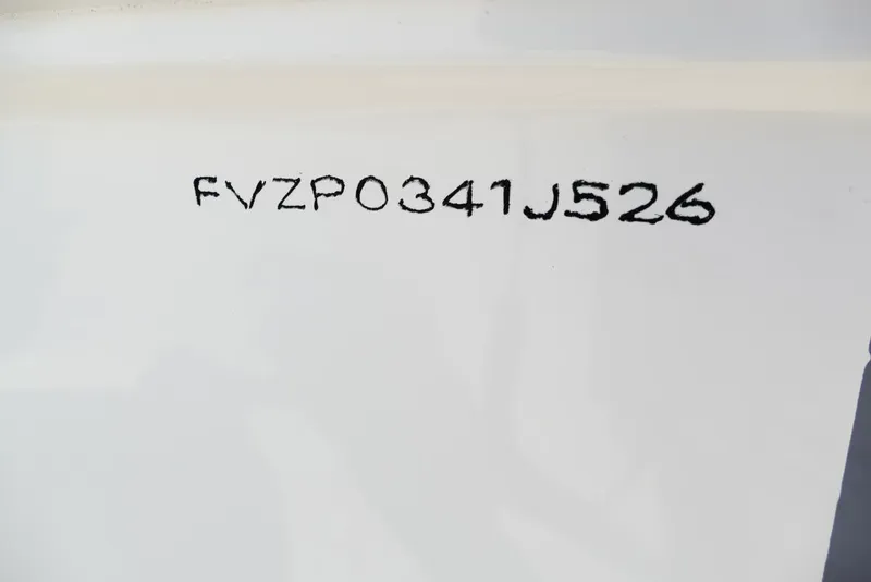 Slide: The Image of 2026 Avenger AV26 hull identification number FVZP0341J526 on white surface. - 65