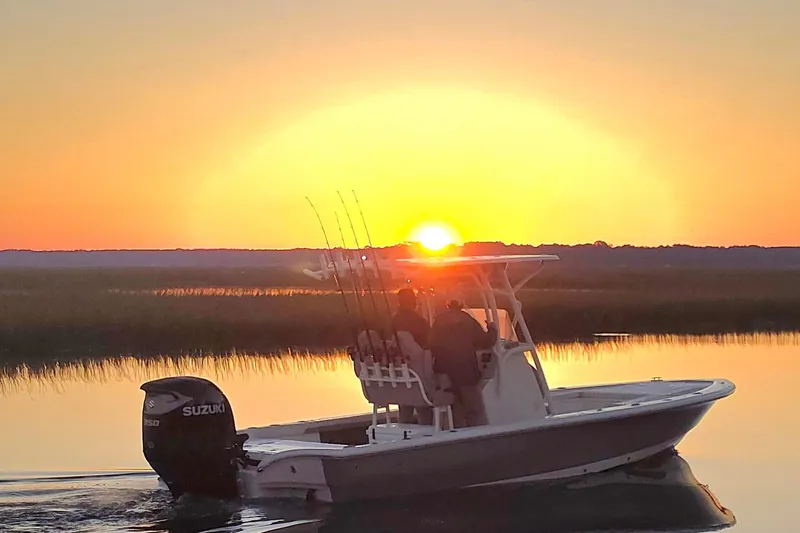 Slide: The Image of Avenger AV26 boat at sunset on calm waters, 2026 model. - 8