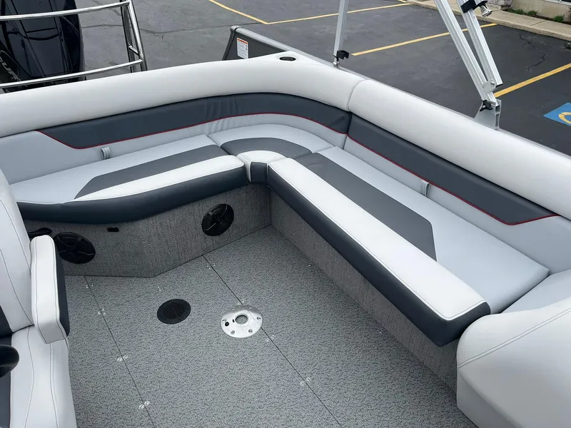 Slide: The Image of 2025 Lowe Deck SD224 boat interior with gray and white seating. - 23