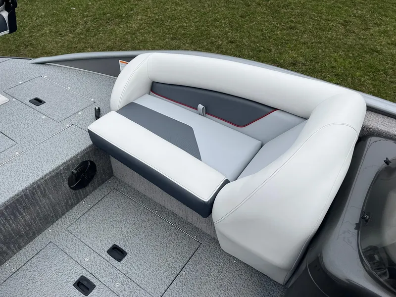 Slide: The Image of 2025 Lowe Deck SD224 boat seat with gray and white upholstery, set against a grassy background. - 29