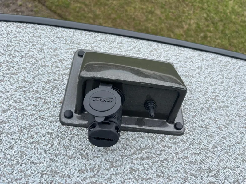 Slide: The Image of Boat deck outlet on 2025 Lowe Deck SD224, featuring a protective cover. - 36
