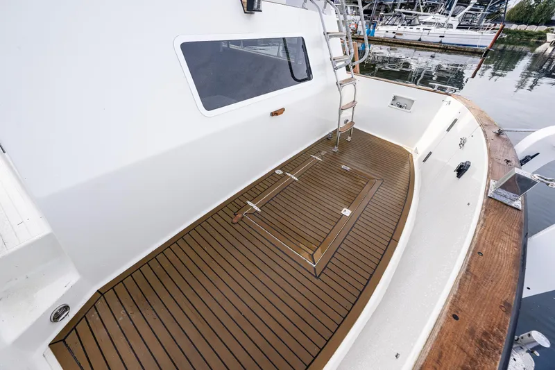 Slide: The Image of 1991 Tollycraft 48 Cockpit Motor Yacht with teak deck, docked at marina. - 16