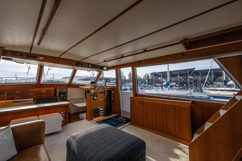Slide: The Image of Interior of 1991 Tollycraft 48 Cockpit Motor Yacht with marina view. - 26