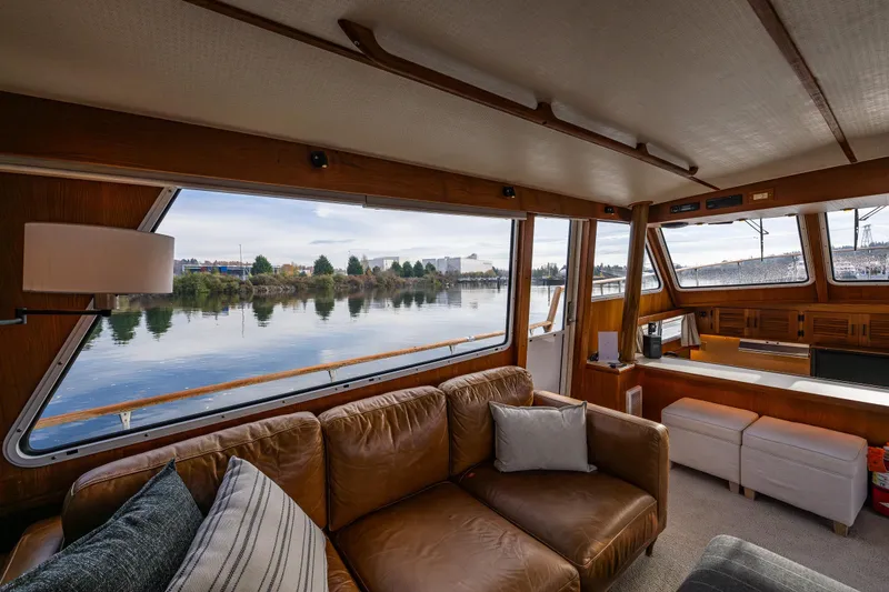 Slide: The Image of Luxurious interior of 1991 Tollycraft 48 Cockpit Motor Yacht with scenic water view. - 27