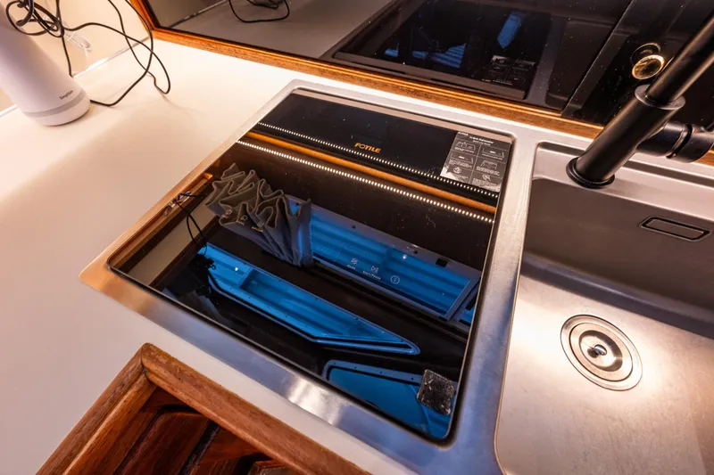 Slide: The Image of 1991 Tollycraft 48 Cockpit Motor Yacht kitchen with stove, sink, and refrigerator. - 34