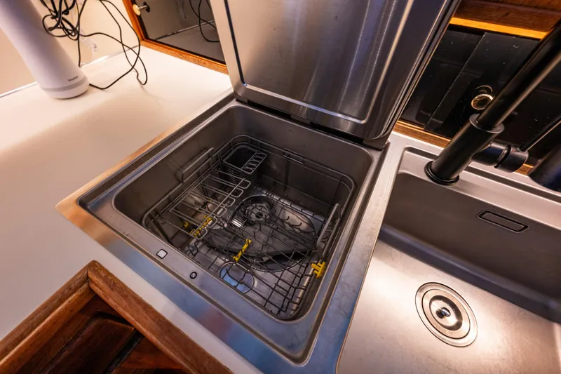 Slide: The Image of 1991 Tollycraft 48 Cockpit Motor Yacht interior with kitchen and cozy bedroom. - 35