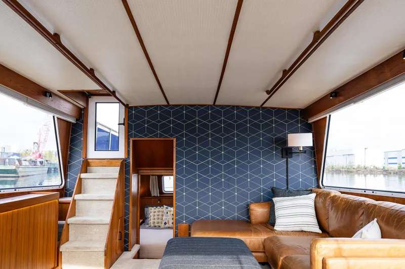 Slide: The Image of Interior of 1991 Tollycraft 48 Cockpit Motor Yacht with wood paneling and seating. - 39