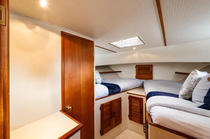 Slide: The Image of Laundry area in 1991 Tollycraft 48 Cockpit Motor Yacht with wooden cabinetry. - 45