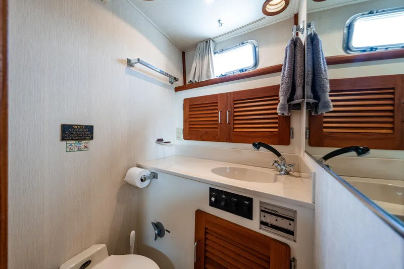 Slide: The Image of Bathroom interior of 1991 Tollycraft 48 Cockpit Motor Yacht with window view. - 47