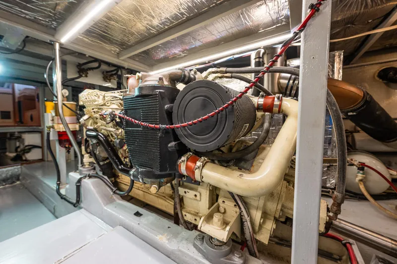 Slide: The Image of Engine room of 1991 Tollycraft 48 Cockpit Motor Yacht, showcasing mechanical components. - 51