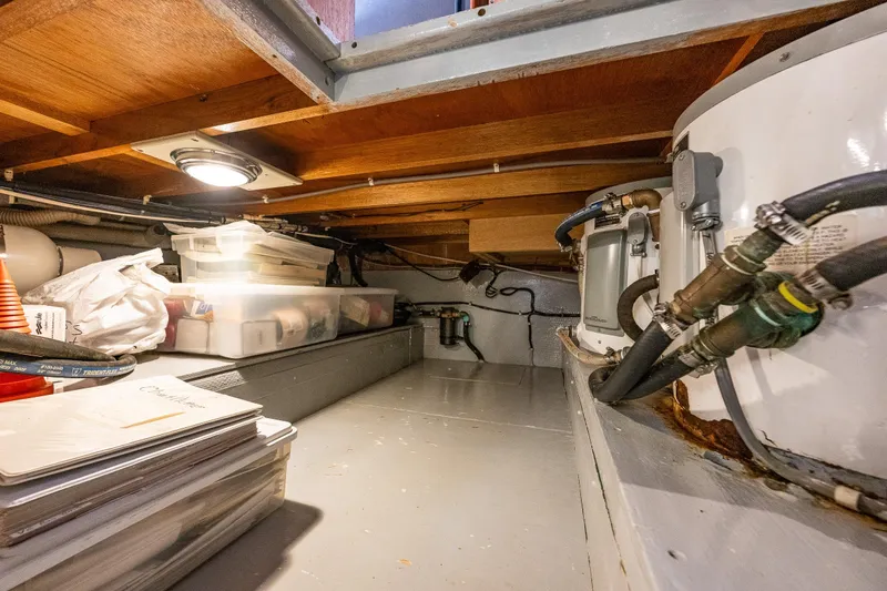 Slide: The Image of Engine room of 1991 Tollycraft 48 Cockpit Motor Yacht, showcasing detailed machinery. - 54