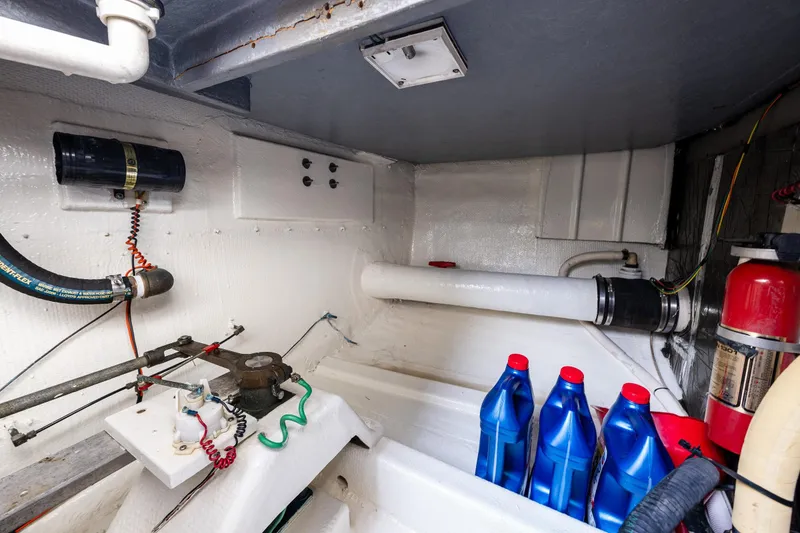 Slide: The Image of Engine room of 1991 Tollycraft 48 Cockpit Motor Yacht with maintenance supplies. - 60