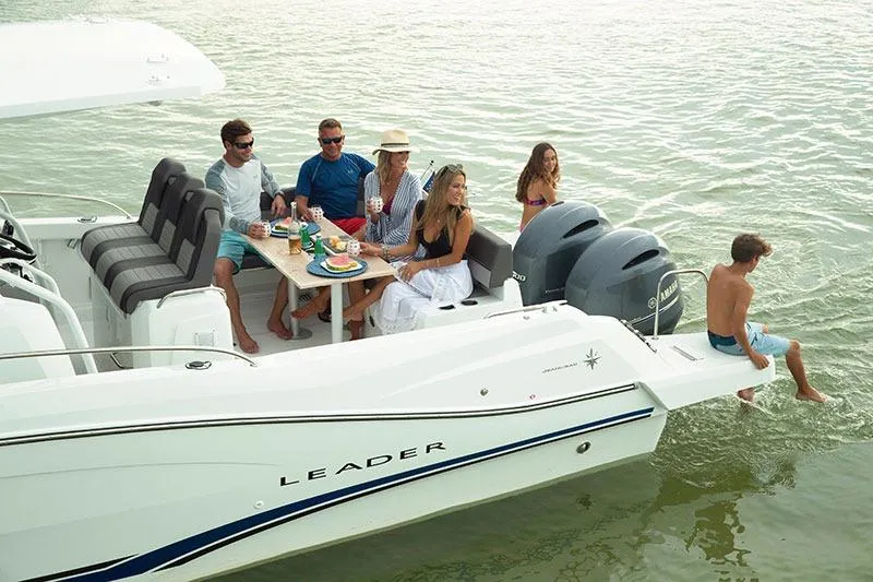 Slide: The Image of 2025 Jeanneau Leader 9.0 CC with people enjoying a day on the water. - 3
