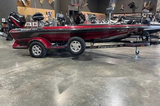 The Image of 2003 Ranger 185 VX boat with trailer in showroom, side view. - 0