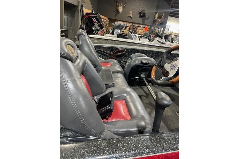 Slide: The Image of Interior of a 2003 Ranger 185 VX boat with leather seats and steering wheel. - 5