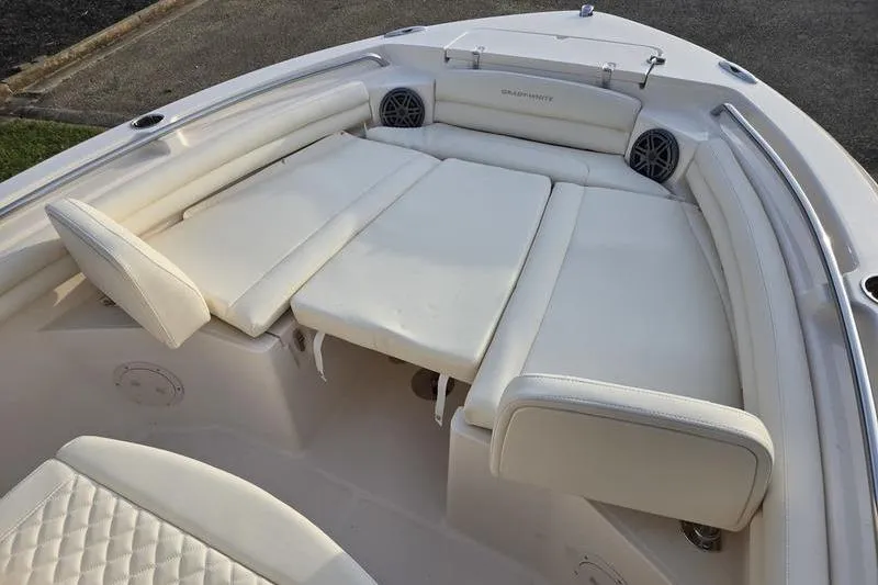 Slide: The Image of 2026 Grady-White Fisherman 216 boat with spacious white cushioned seating area. - 14