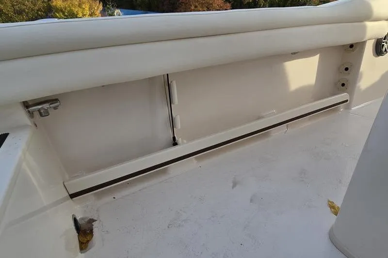 Slide: The Image of 2026 Grady-White Fisherman 216 boat interior detail, showcasing storage compartment. - 20