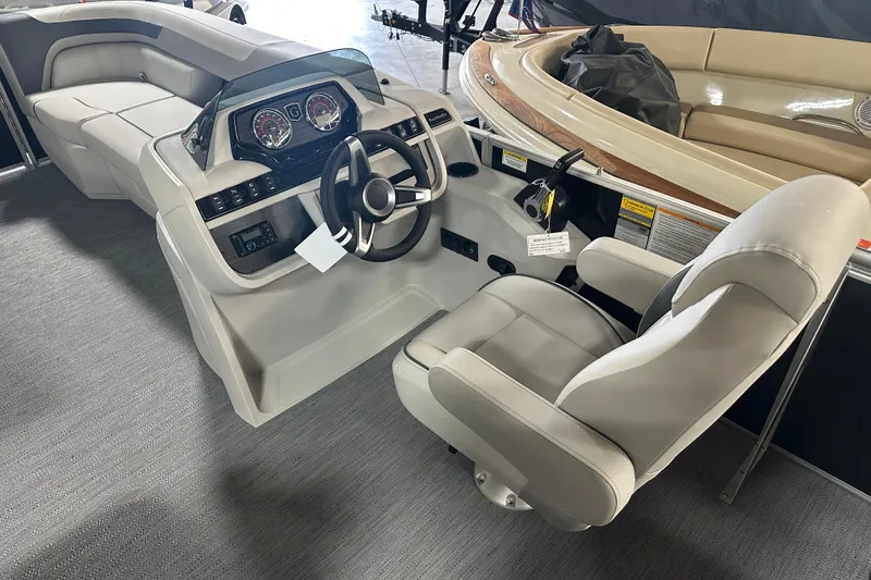 Slide: The Image of Interior of 2026 Godfrey SW 2286 SFL boat with modern steering console and seating. - 15