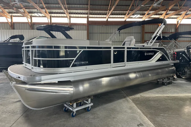 Slide: The Image of 2026 Godfrey SW 2286 SFL pontoon boat in a storage facility. - 19