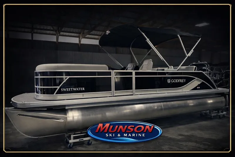 Slide: The Image of 2026 Godfrey SW 2286 SFL pontoon boat at Munson Ski & Marine showroom. - 21