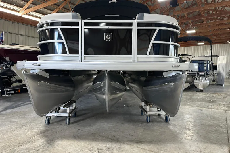 Slide: The Image of 2026 Godfrey SW 2286 SFL pontoon boat in a storage facility. - 3