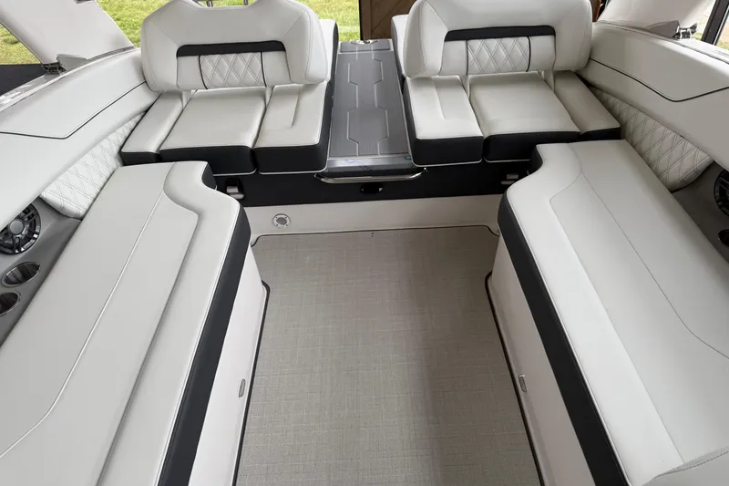 Slide: The Image of Luxurious interior of 2025 Regal LS6 boat with elegant white seating. - 12