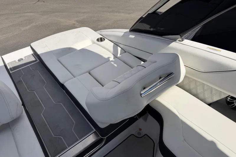 Slide: The Image of 2025 Regal LS6 boat interior with white seating and sleek design. - 17