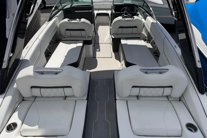 Slide: The Image of Luxurious interior of 2025 Regal LS6 boat with spacious white seating. - 19