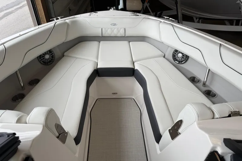 Slide: The Image of Luxurious interior of 2025 Regal LS6 boat with white seating and modern design. - 3