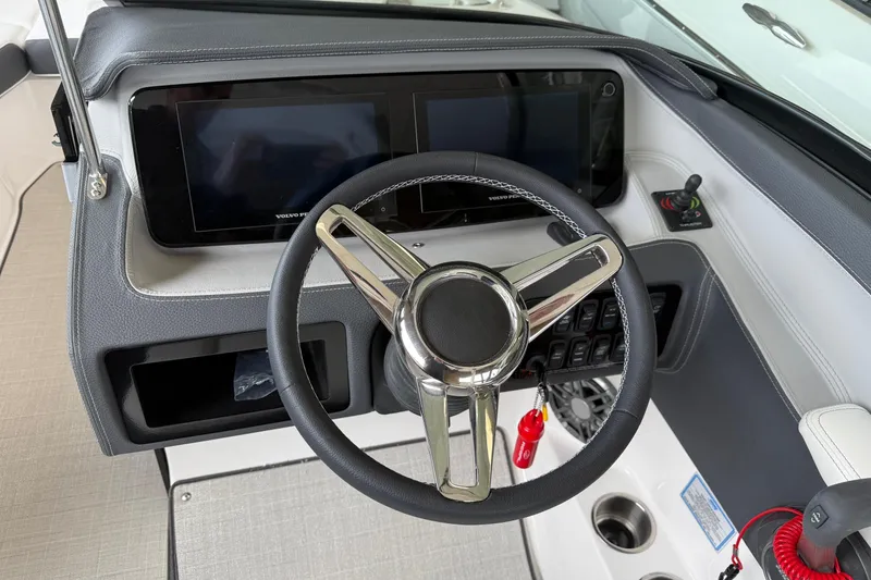 Slide: The Image of 2025 Regal LS6 boat dashboard with steering wheel and digital displays. - 4