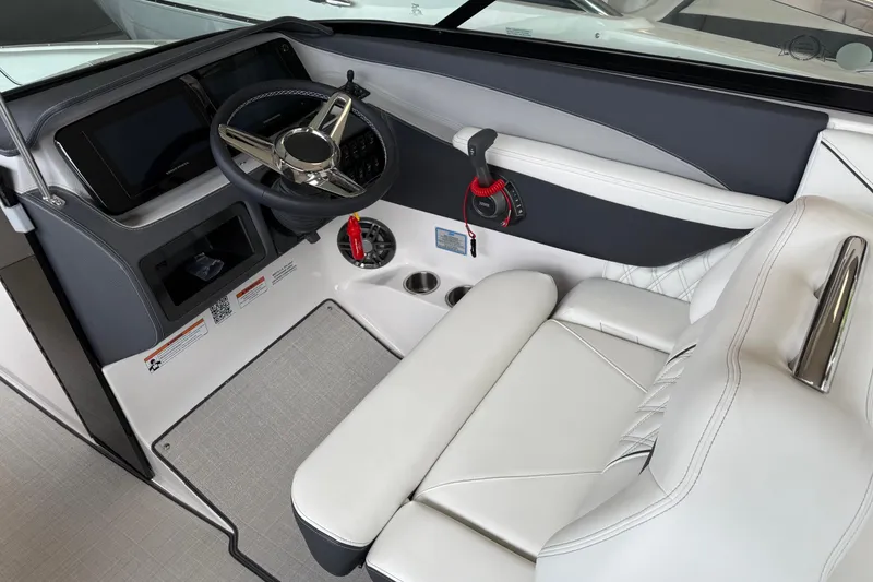 Slide: The Image of 2025 Regal LS6 boat interior with modern steering wheel and luxurious seating. - 5