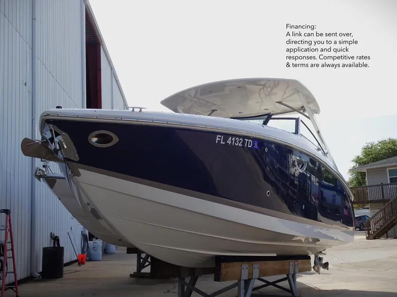 Slide: The Image of 2018 Cobalt R30 boat on a stand outside a storage facility. - 2