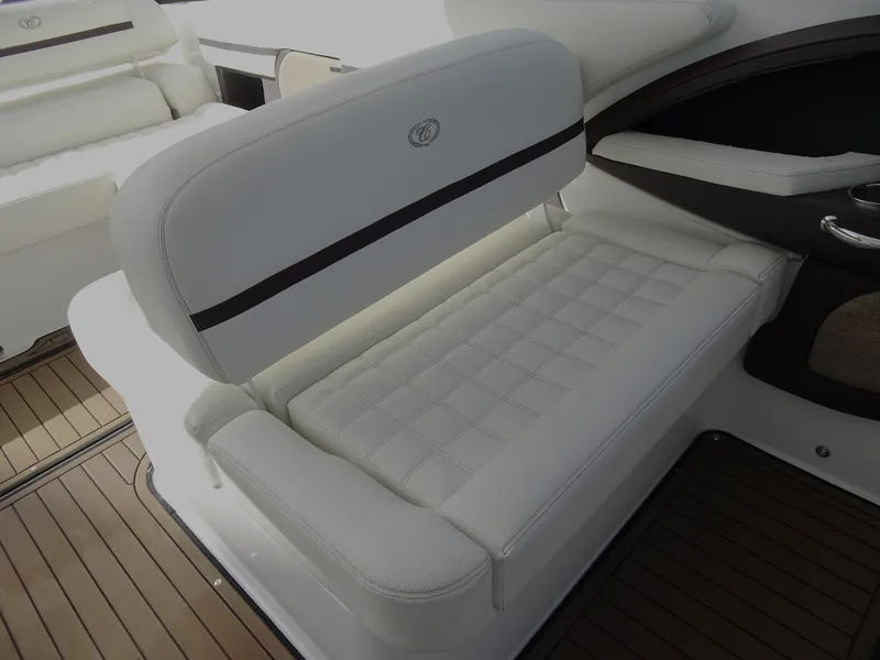 Slide: The Image of 2018 Cobalt R30 boat interior with white cushioned seating. - 20