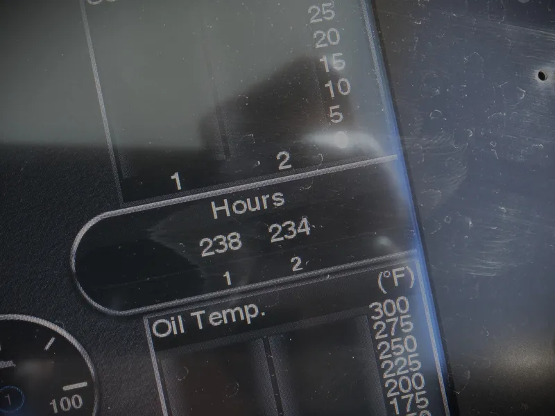 Slide: The Image of Close-up of 2018 Cobalt R30 dashboard showing engine hours and oil temperature. - 30
