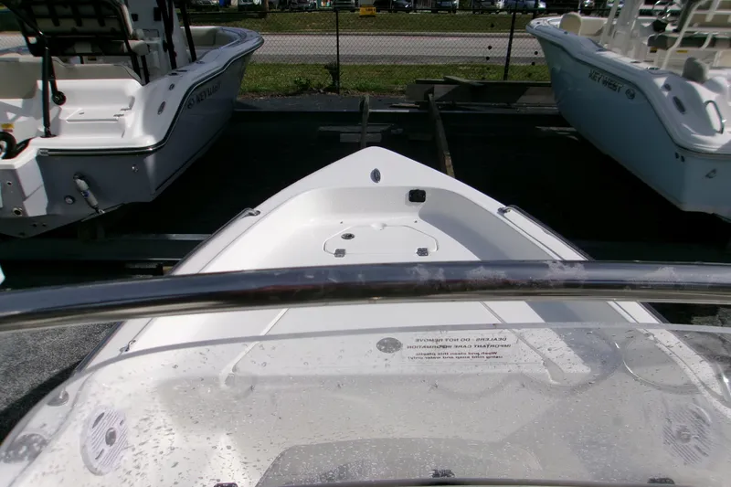 Slide: The Image of 2026 Key West 1720 Center Console boat on display at a dealership. - 10