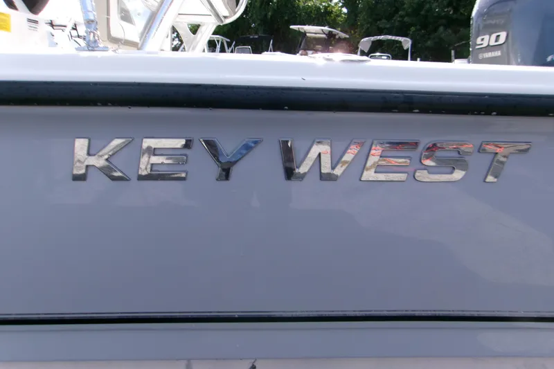 Slide: The Image of 2026 Key West 1720 Center Console boat with chrome lettering detail. - 12