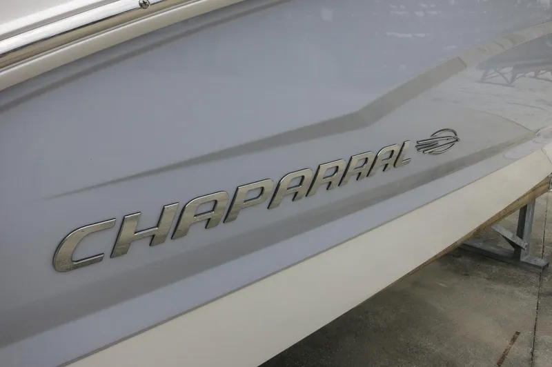 Slide: The Image of 2024 Chaparral 19 SSi boat side view with logo. - 11