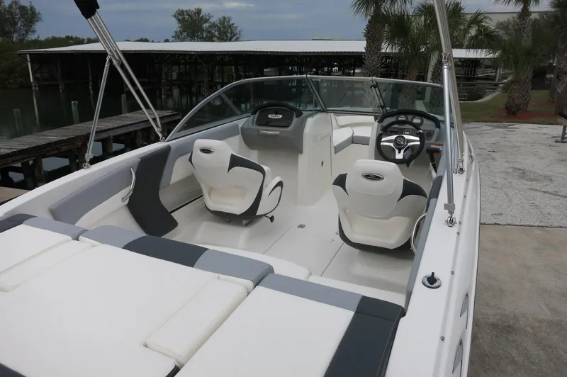 Slide: The Image of 2024 Chaparral 19 SSi boat interior with white and gray seating. - 12
