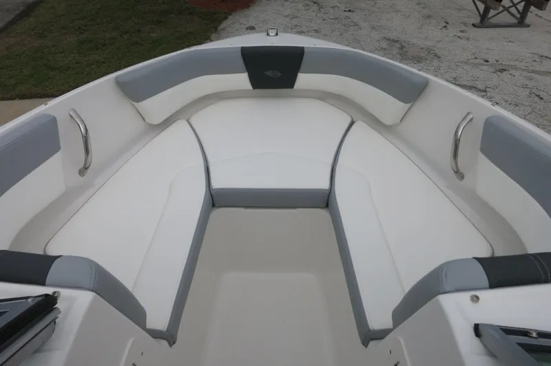 Slide: The Image of 2024 Chaparral 19 SSi boat interior with white and gray seating. - 17
