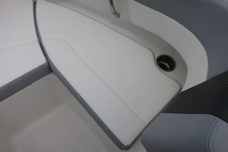Slide: The Image of 2024 Chaparral 19 SSi boat interior seating with cup holder. - 18