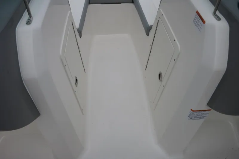 Slide: The Image of Interior deck of 2024 Chaparral 19 SSi boat with storage compartments. - 20