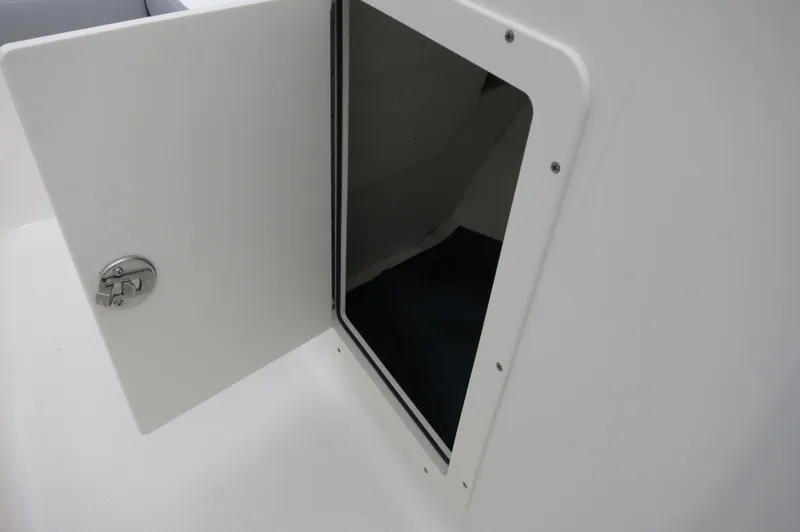 Slide: The Image of Open storage compartment on 2024 Chaparral 19 SSi boat. - 22